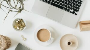 Flatlay of a workspace, where mindfulness has helped reduce staff sickness levels